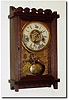 C.1891, Waterbury Clock Co., "Racer' model wall clock in clean, restored condition, running, striking and alarming.