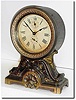 C.1910, Seth Thomas "Long Alarm', the top a pressed brass canister and the base of spelter with antique finish.