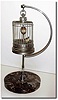 C.1950, German, Rocking Bird in Cage, with chrome stand on a marble base.