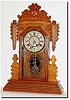 C.1895, Attleboro Clock Co., Attleboro, Mass, very uncommon gingerbread clock in very good original condition. Included with this clock is information compiled by Jim Erickson, the Attleboro guru on the Internet.