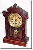 C.1870, Terry Clock Co, small walnut cottage clock, the front door scalloped and incised like a larger walnut parlor clock.