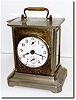 C.1900, German, Musical Alarm clock, nickel over stamped steel construction, alarming with the tune of "Dixie'.