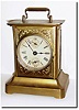 C.1900, German, Musical Alarm clock, stamped steel construction, now painted gold, alarming with two good tunes:"Bicycle Built for Two' and "My Country "Tis of Thee'.