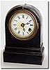 C.1868, Terry Clock Co., Waterbury, Conn, smallest iron timepiece with original dial, hands and bezel.