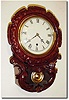 Mixed lot: A C.1850, Mini English carved drop dial case that undoubtedly had a fusee movement, NOW with an American, Jerome 8-day time only open spring movement.
