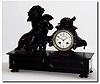 C.1895, French, Patinated Spelter, Figural clock of a large winged cherub.