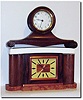 A lot of two 30 hour shelf clocks: One mahogany tambour with cracked porcelain dial, running; plus a walnut veneer on brown onyx desk clock (C.1950), with copper bezel and dial center, also running.