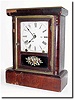 C.1875, New Haven Clock Co., 8-Day Cottage, a once elegant shelf clock, now with the veneer all loose.