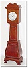 C.1950, A German 30-hour "over-ocean' alarm clock, now in a purpose made broken arch "tall' case from the same period, by a handy cabinet maker, with cross banded inlay on the bombay base, trunk and hood.