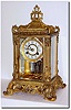 C.1905, Waterbury "RENNES' Fancy Crystal regulator with optional brilliant ring sash, this model with solid two piece dial.