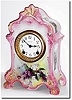 C.1905, Ansonia "La Farge" Porcelain China clock in light pink with mixed white and lavender violets on a pale yellow background, and in perfect original condition.