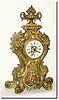 C.1880, French, Large and Impressive Bronze clock, a lion at the base amidst large scrolls, the dial flanked by two cornucopia, overflowing with vegetables, and the case surmounted by an urn with pineapple and apples; note bronze has blue and brown oxidation in the crevices.