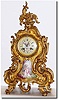 C.1900, French, a good Louis XVI style mantel clock with a lovely hand painted panel of a lady and gentleman in the park, and the porcelain dial with a winged cherub in the clouds and each numeral in a gold frame.