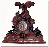 C.1880, Swiss for the French market, a carved figural clock, showing an eagle attacking a wolf.