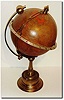 C.1890, French, for S. Smith and Sons, London, a globe clock, complete with a movable sun and local time pointer.