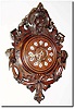C.1890, French, Walnut cartel clock with carved lion at top and ribbons and scrolls at the bottom.