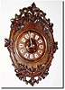C.1890, French, Walnut cartel clock, the outer branch carved like a bent wood frame, and with ivy leaves all around as accents.