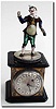 C.1790, Austrian, Enamel over copper Fasching Jester, with striped hat and spats and with a noise making clapper in his left hand.