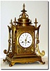 C.1890, French, Architectural form, all ormolu clock, in interesting temple motif, with profusely engraved case.