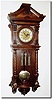 C.1885, Austrian, 3-Weight Grand Sonnerie wall clock in an interesting "open well' design, the walnut case with full turned columns and with 10 pieces of heavy cast brass trim.