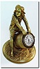 C.1910, French Bronze of a boy in mid pants, knee socks, spats and hat, straddling a wooden slat pickle barrel.