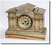 C.1900, French, for W. L. Kelley, New Bedford, Mass (signed dial) a tan onyx mantel clock in good original condition.