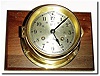 C.1965, German, "Sale m' Ship"s Bell striking wall clock, mounted to a rectangular piece of walnut.