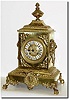 C.1890, French, Cast Brass mantel clock, in architectural form with a bust of Diana below the dial and the sides with lion busts with brass rings from their mouths.