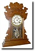 C.1895, Waterbury "NORWALK" walnut time and strike mantel clock