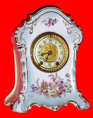Mixed Lot, C.1905, German, Marked KPM, porcelain china clock case with sunrise forest scene on base, now with a Waterbury 8-day movement. — Antique Clocks Price Guide