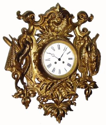 C.1890, French, Gilt Cast Iron Wall clock, the movement probably from another clock as it is a bit too deep for the case, and is held into the iron casting by 2 wood screws forced into the brass bezel. — Antique Clocks Price Guide