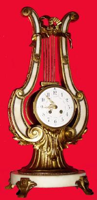 C.1890, French, Mougin, Lyre form mantel clock of marble and gilt white metal, large. Bell strike 8-day movement with the award mark of Mougin. — Antique Clocks Price Guide