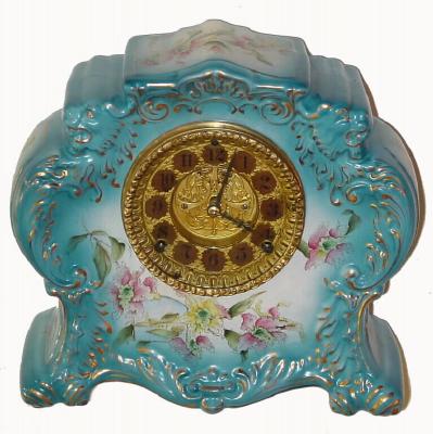 C.1898, William L. Gilbert Clock Co., "No. 411", 8-day time/strike porcelain mantel clock, with open escapement on dial. — Antique Clocks Price Guide