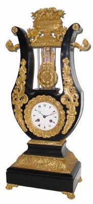 C.1880, French, Marti, lyre form mantel clock, 8-day time/strike, made for the Turkish market is an ebonized wood case with applied fire gilded mountings. — Antique Clocks Price Guide