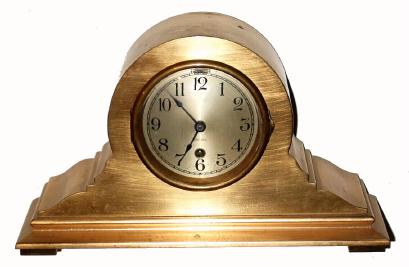 C.1934, Chelsea Clock Co., Boston, Tambour No. 15, in a red brass case with 4" dial, time only. — Antique Clocks Price Guide