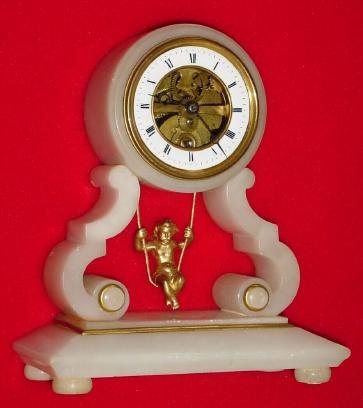 C.1890, French, Swinging Doll clock, in a white alabaster case, 8-day time only. — Antique Clocks Price Guide