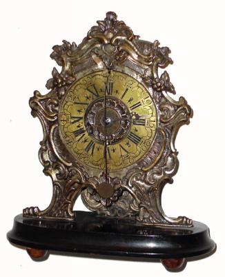 Mid 19th Century, Austrian copy of an early 17th century table alarm clock with cows tail pendulum. — Antique Clocks Price Guide