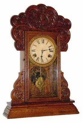 C.1906, Waterbury Clock Co., "Henshaw", 8-day time/strike oak gingerbread clock. — Antique Clocks Price Guide