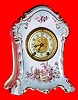 Mixed Lot, C.1905, German, Marked KPM, porcelain china clock case with sunrise forest scene on base, now with a Waterbury 8-day movement. 