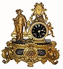 C.1890, French, Gold Painted Spelter figural clock, a young man with a shovel in his right hand and a bouquet of flowers in his left hand. 