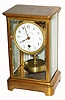 C.1915, French, Grivolas, "Pendule 400 Jours" in a brass and glass 4 glass case, serial number 3184-0, with matching number on disc pendulum. 