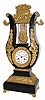 C.1880, French, Marti, lyre form mantel clock, 8-day time/strike, made for the Turkish market is an ebonized wood case with applied fire gilded mountings. 