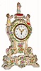 C.1920, French, Leroy and Cie, Porcelain cased timepiece, 3 cherubs over the dial, flowers in relief, and with separate decorated base. 