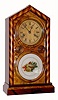 C.1880, Ingraham "Candy Stripe" DORIC, with alternating maple and walnut veneers, 30 hour time and strike. 