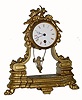C.1890, French, Swinging Doll clock, time only, in a gilt white metal case surmounted by love birds. The movement is a typical "double escape wheel" with chaff cutter verge. The movement is signed eschappement brevete. 