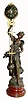 C.1900, French, Patinated Spelter Mystery Swinging Timepiece, female statue of Glannuse, on a painted faux shell base, bearing a plaque with the title of the statue and the artist. 