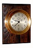 C.1939, Chelsea Clock Co., Ships Timepiece, 6" dial, red brass case with screw bezel, mounted on a soft wood board, stained dark. 