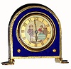 C.1925, German, Ladies Boudoir clock, with a pastel portrait of a youthful couple in courtship. The gilt brass case with cobalt blue enamel around the dial and a woven pattern of white enamel around the outer edge. 