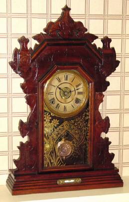 C.1893 (dated), Seth Thomas, Walnut Gingerbread clock, 8-day, time, strike and alarm, Harvard variant. — Antique Clocks Price Guide