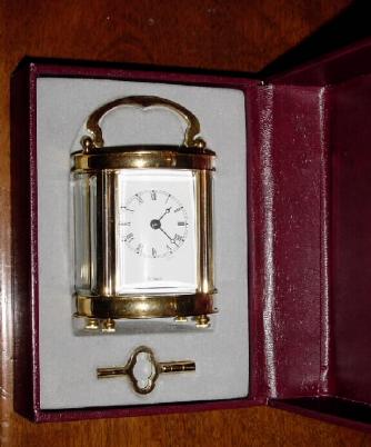 C.2002, China, New Old stock, oval carriage timepiece, miniature size, in red gift box. — Antique Clocks Price Guide